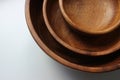 Three wooden empty food bowls stacked on top of each other Royalty Free Stock Photo