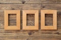 Three wooden frame or photo frame over wooden background, copy space, design and home interior Royalty Free Stock Photo