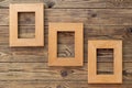 Three wooden frame or photo frame over wooden background, copy space, design and home interior Royalty Free Stock Photo