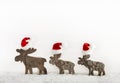 Three wooden handmade reindeer on a background with place for te Royalty Free Stock Photo