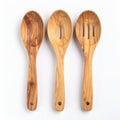 Three Wooden Kitchen Spoons on White Background in Flat Lay Still Life Royalty Free Stock Photo
