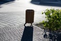 Three wooden litter bins in public area