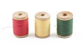 Three wooden multicolored thread coils on white