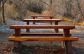 A series of wooden park benches along the beach pathway in Osoyoos BC Royalty Free Stock Photo