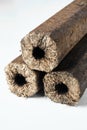 Three wooden pressed briquettes Pini Kay from biomass Royalty Free Stock Photo