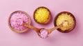 Three Wooden Spoons Filled With Different Colored Sugar