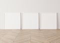 Three wooden square frames Standing on parquet floor with white background