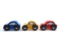 Three wooden toy cars in a row Royalty Free Stock Photo