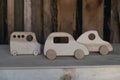 thre toy car made of hand-made wood and located on a plywood table, a fuzzy background of untreated, unplaned boards.Deforestation Royalty Free Stock Photo