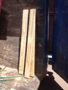 Three Wooden 2x4s in a Construction Dumpster