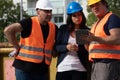 Three workers on construction site Royalty Free Stock Photo