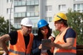 Three workers on construction site Royalty Free Stock Photo