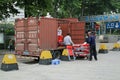 Men unloading folding chairs from the back of a truck, Dongguan City, Guangdong Province, China Royalty Free Stock Photo