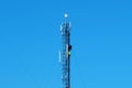Three workers repair a cell tower. Laying new cables. High-altitude work Royalty Free Stock Photo