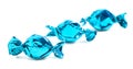 Three Wrapped Blue Candy on a White Background Royalty Free Stock Photo