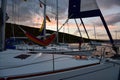 Three yachts anchoring in bay at sunset