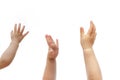 Three 1 year old babies raise hands to show their wish isolated on white