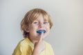 Three-year old boy shows myofunctional trainer to illuminate mouth breathing habit. Helps equalize the growing teeth and correct Royalty Free Stock Photo