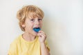 Three-year old boy shows myofunctional trainer to illuminate mouth breathing habit. Helps equalize the growing teeth and correct Royalty Free Stock Photo