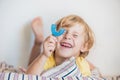 Three-year old boy shows myofunctional trainer to illuminate mouth breathing habit. Helps equalize the growing teeth and correct Royalty Free Stock Photo