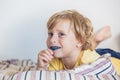 Three-year old boy shows myofunctional trainer to illuminate mouth breathing habit. Helps equalize the growing teeth and correct Royalty Free Stock Photo