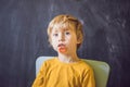 Three-year old boy shows vestibular plate. Plate with a bead to Royalty Free Stock Photo