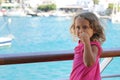 three-year-old girl admires the view of the Cyclades from the ferry Royalty Free Stock Photo