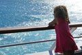 three-year-old girl admires the view of the Cyclades from the ferry
