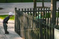 The child looks through the hole in the fence Royalty Free Stock Photo