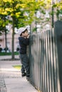 The child looks through the hole in the fence Royalty Free Stock Photo