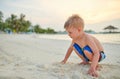 Three year old toddler boy on beach at sunset Royalty Free Stock Photo