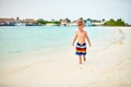 Three year old toddler boy on beach at sunset Royalty Free Stock Photo