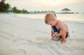 Three year old toddler boy on beach at sunset Royalty Free Stock Photo