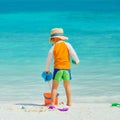 Three year old toddler playing on beach Royalty Free Stock Photo