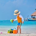 Three year old toddler playing on beach Royalty Free Stock Photo