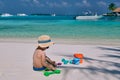 Three year old toddler playing on beach Royalty Free Stock Photo