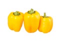 Three yellow bell peppers isolated against white Royalty Free Stock Photo