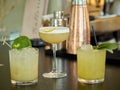 Three yellow colored cocktail drinks on a bar counte Royalty Free Stock Photo