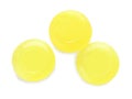 Three yellow cough drops on white background, top view Royalty Free Stock Photo