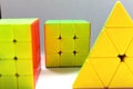Three yellow cubes for speedcubing on a light background Royalty Free Stock Photo