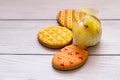 Three yellow easter cookies with a chik on the right