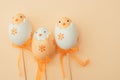 Three yellow Easter eggs chick on yellow background family Royalty Free Stock Photo