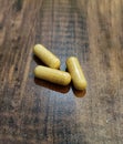 Three Yellow Herbal Capsules Made From Turmeric