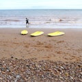 Three yellow kayaks