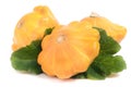 Three yellow pattypan squash with leaf isolated on white background Royalty Free Stock Photo