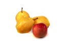 Three yellow pears and a red apple, isolate on a white background. Royalty Free Stock Photo