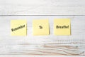 Three Yellow Post It notes with Message Remember to Breathe!