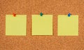 Three Yellow Post-it Sticky Notes on a cork board Royalty Free Stock Photo