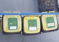 Three yellow wheelie bins for the segregation of garbage on the deck of a Vessel in the North Sea