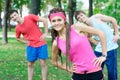 Three young adults exercising outdoors Royalty Free Stock Photo